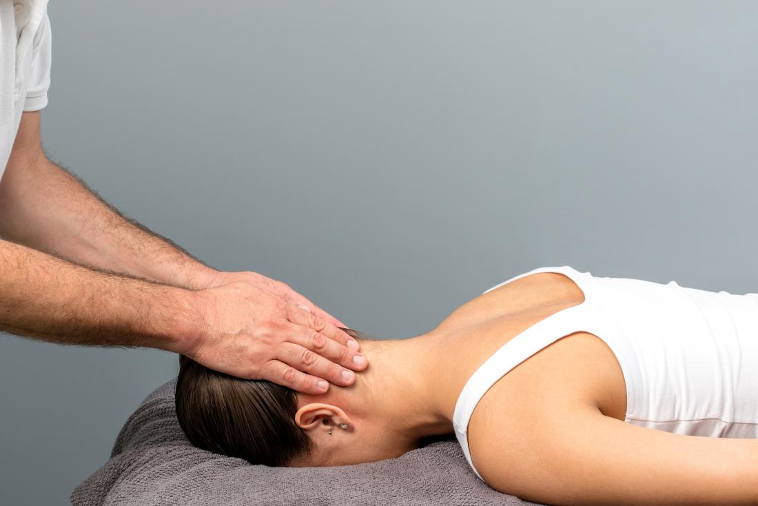 Woman having neck and shoulder massage.