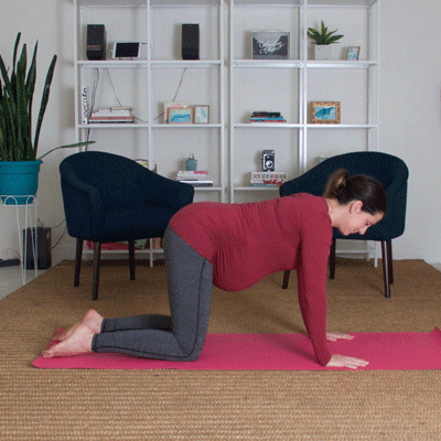 Pregnant woman performing a kneeling lunge stretch for sciatica