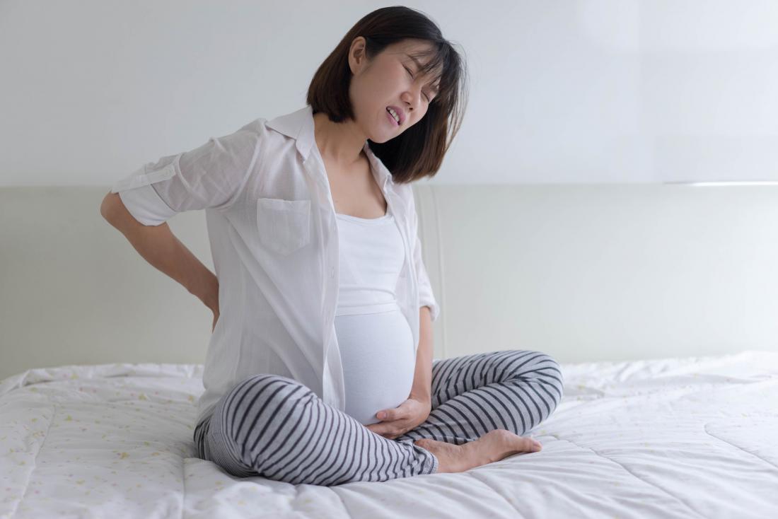 Pregnant woman with back pain due to sciatica