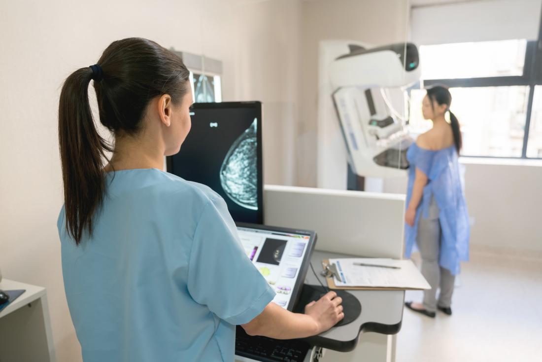 physician looking at patient's mammogram