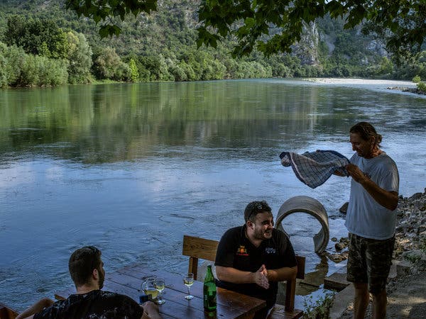 Wine is served at a cafe on the banks of the Neretva River near the town of Zitomislici.