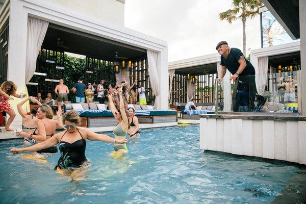 Splashy, not flashy: In his role as &ldquo;ambassador of fun&rdquo; at Omnia Day Club Bali, Mark Baker hypes up guests in the pool.