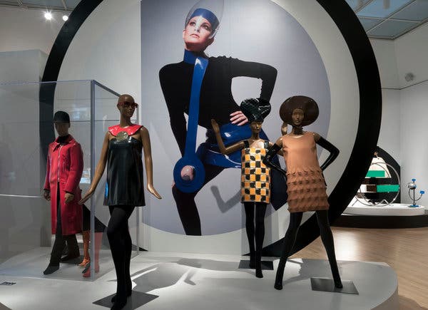 An installation at the Brooklyn Museum showing a photo of Raquel Welch in a Cardin miniskirt and necklace in blue vinyl with a Plexiglas visor, shot by Terry O&rsquo;Neill in 1970.