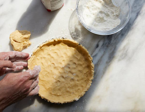 The shortbread crust is pressed directly into a tart pan, no rolling necessary.