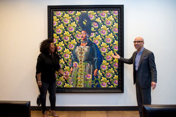 Mr. Walker with Kehinde Wiley&rsquo;s portrait of Wanda Crichlow, left, from the public housing projects of East New York, Brooklyn.