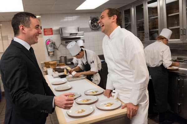Mr. Guidara, left, and Mr. Humm in the kitchen of Eleven Madison Park in 2015. They bought the restaurant from their mentor, the restaurateur Danny Meyer, in 2011.
