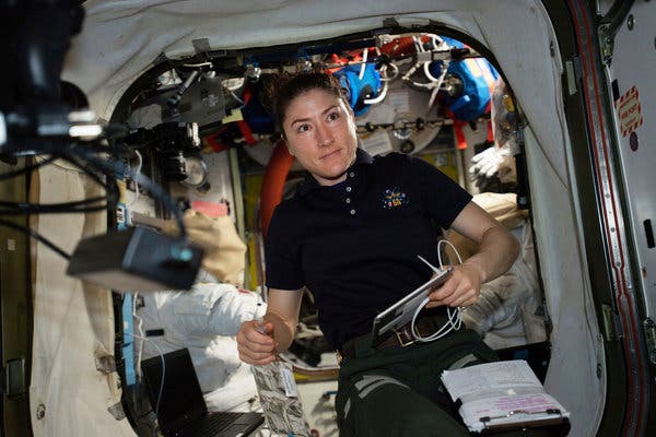 Flight engineer Christina Koch at work on U.S. spacesuits in the International Space Station in April. She had been scheduled, along with Anne McClain, to perform the first all-female space walk on March 29, but spacesuits designed for men meant Chris Hague had to replace Ms. McClain on the walk.