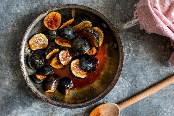 The figs release their juices into a pan of caramel. 