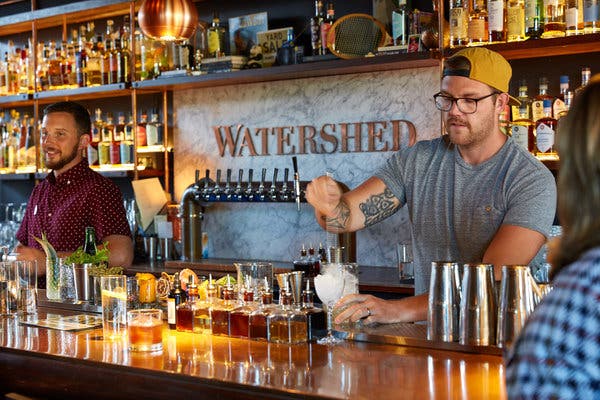 A bartender makes a cocktail at Watershed Kitchen & Bar, a full-service restaurant attached to Watershed Distillery in Columbus. 