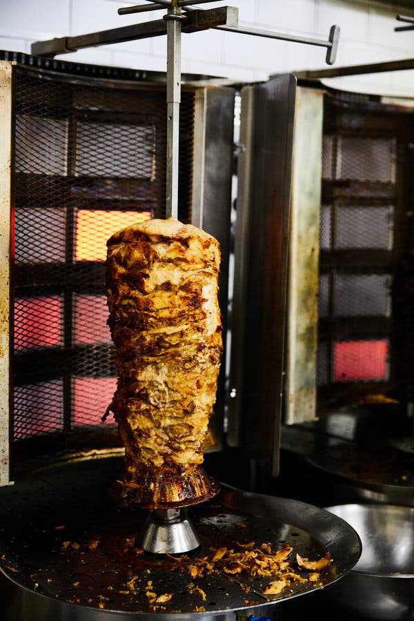 The restaurant has two steadily rotating vertical broilers, their thick metal skewers heavy with marinated meats.