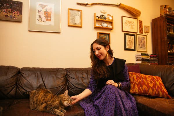 Ms. Grossman and her cat, Remy, at their home in Park Slope, Brooklyn.