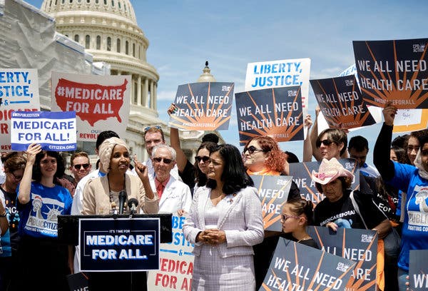 Representatives Ilhan Omar, at lectern, and Pramila Jayapal during a news conference in June on the Medicare for All Act of 2019. The failure to pass a measure against surprise billing does not bode well for the chances of something far more ambitious like universal health care.