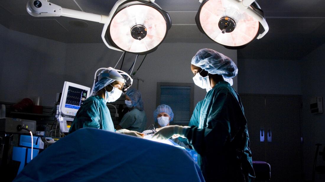 surgeons performing Breast reduction surgery