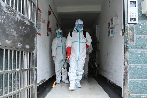 Health workers disinfect a residence in Ruichang, China, a city in Jiangxi Province. A coronavirus outbreak that has left more than 100 people dead began in the neighboring province of Hubei. 