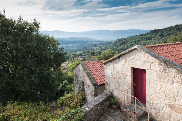 The three-acre property includes two one-bedroom guesthouses overlooking the Rio Minho valley and the mountains of northern Portugal.