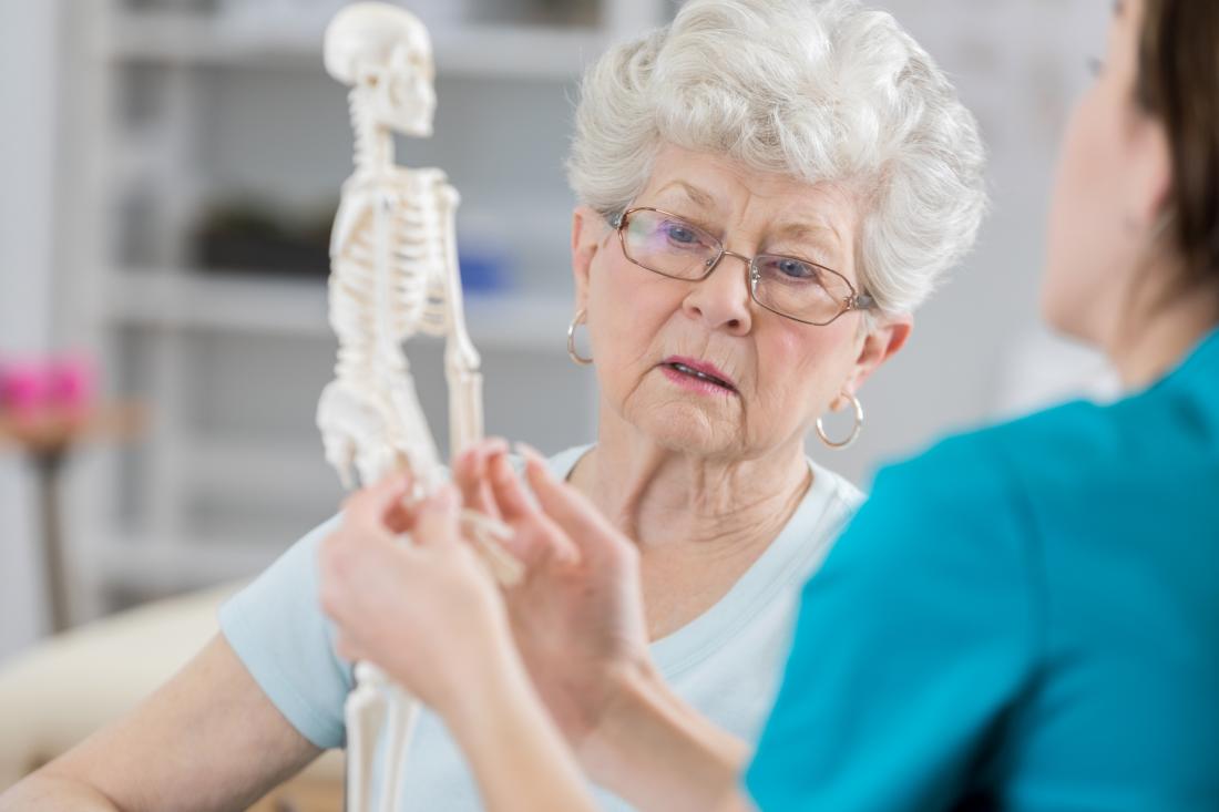 senior woman shown a skeleton