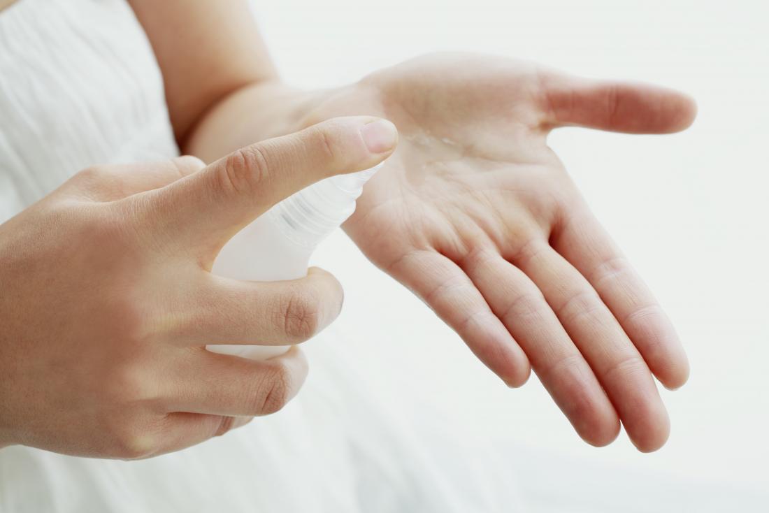 Person putting moisturizer lotion on their hands