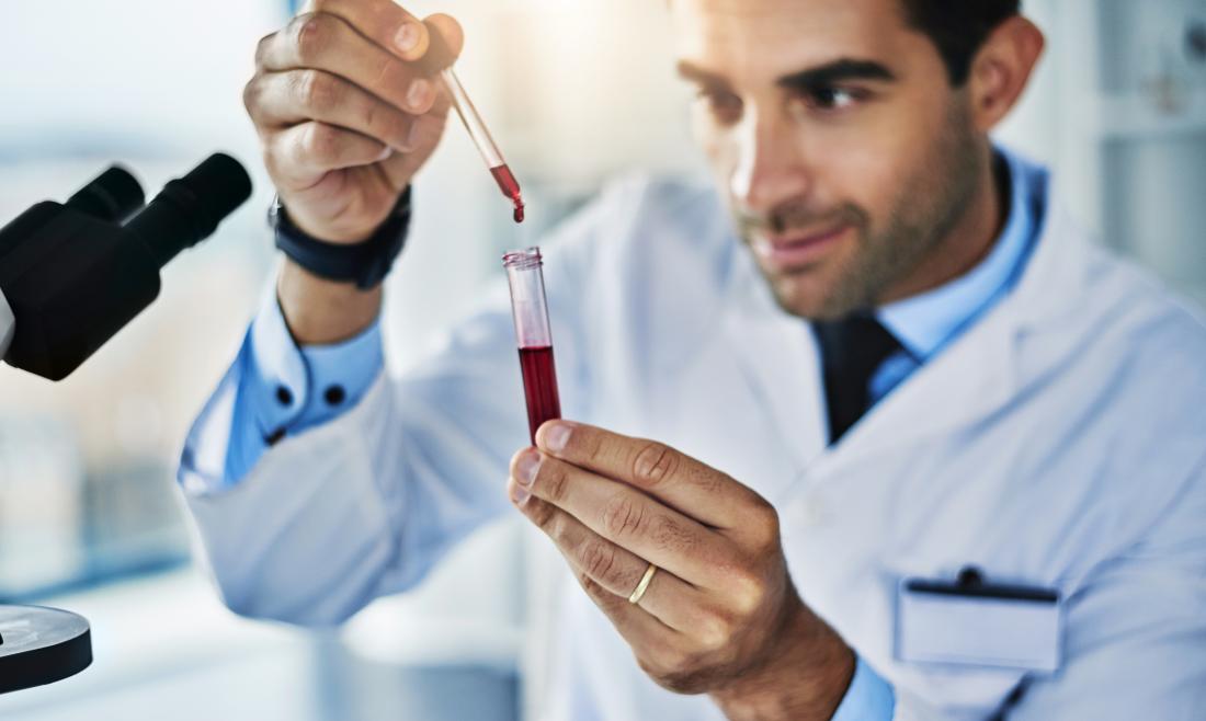 Lab technician working with a blood sample for a cholesterol test