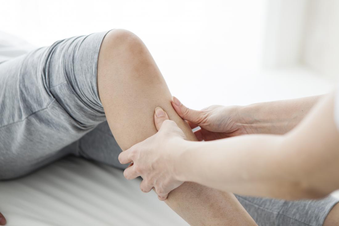 Person having leg massage to treat MS pain.