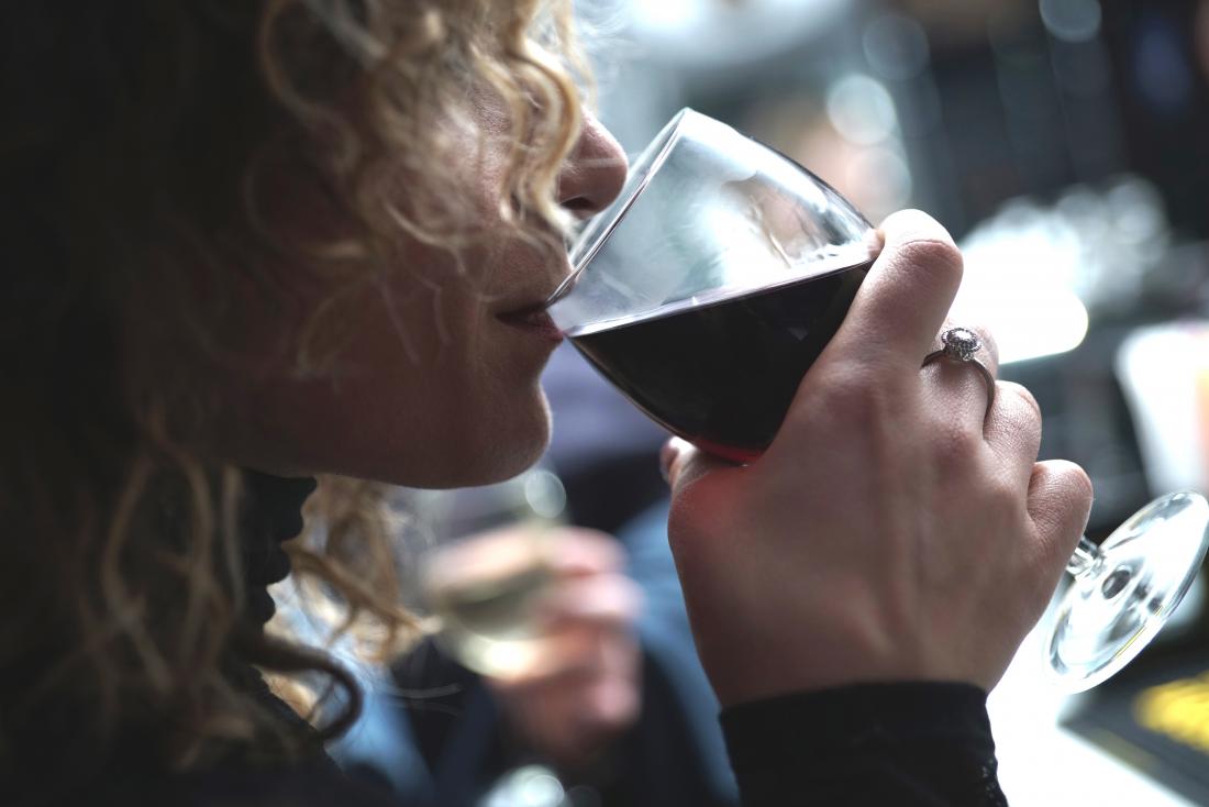 woman drinking a glass of wine