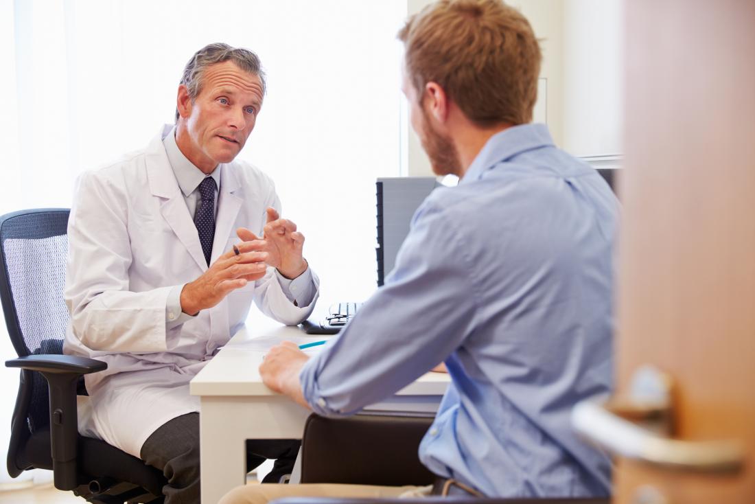 male patient speaking to doctor