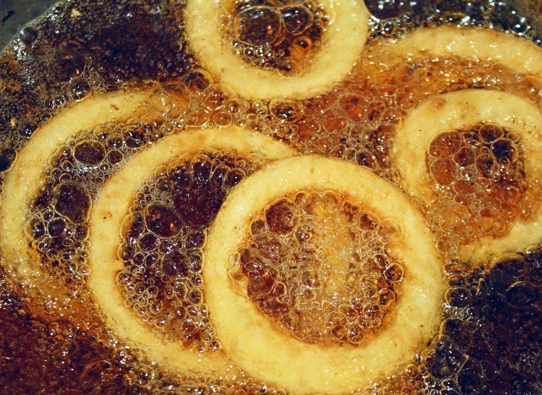 Onion rings cooking in oil