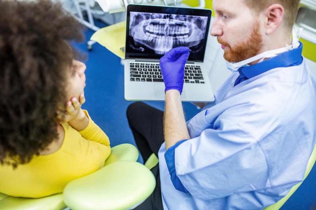 dentist showing patient their dental xray