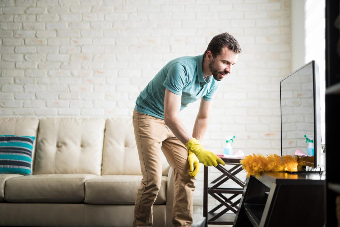 man dusting a surface exposed to endocrine disrupting chemicals
