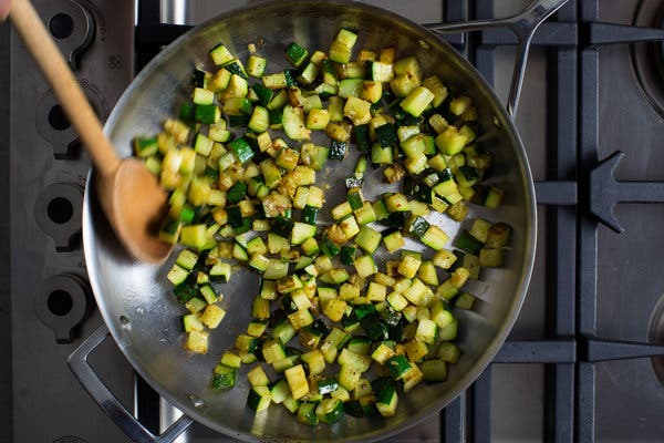 Zucchini is briefly sautéed before being tossed with the spaghetti and pesto.