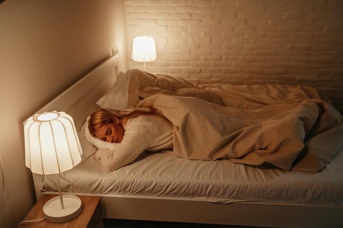 Woman sleeping with lights on