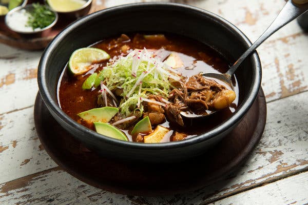 Casa Enrique’s brunch menu has plenty to satisfy everyone, like this deeply flavorful red pozole with tender nubs of hominy and strands of shredded pork.