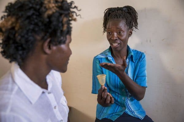 Health workers in Nairobi discuss use of the menstrual cup, distributed to women in a poor community.