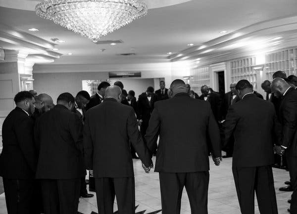 The grooms praying together just before their 2016 wedding ceremony began.