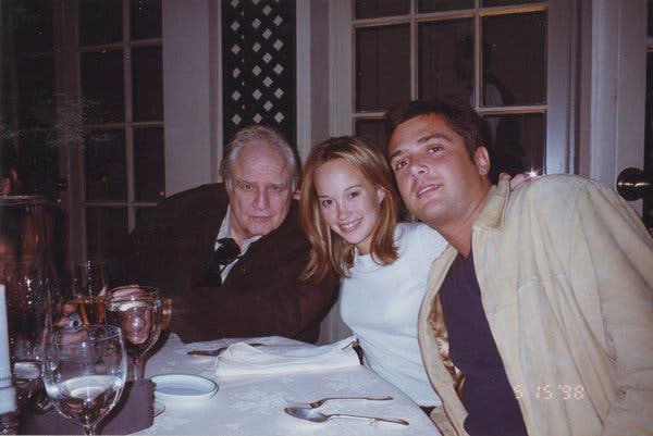 Marlon Brando, far left, dining with Petra Brando Fischer and Russel Fischer in 1998.