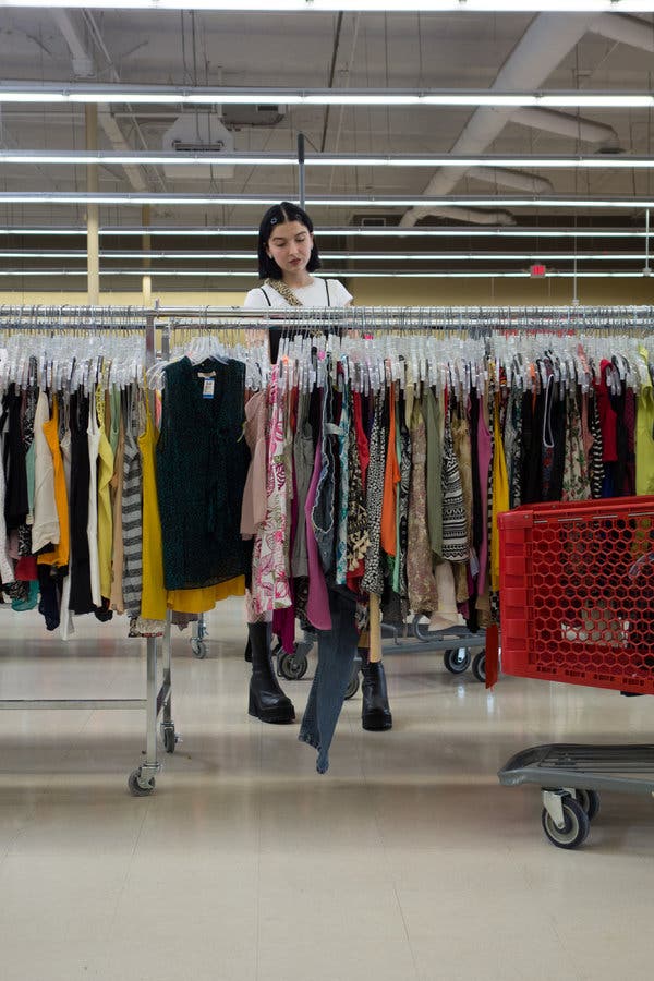 Ms. McFadden shops for thrifted clothing to stock her online store, in Arcadia, Calif.