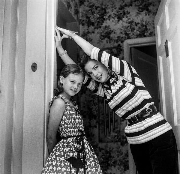 Leaning in: Lana Wood, left, and Natalie Wood at home in Los Angeles in 1955.