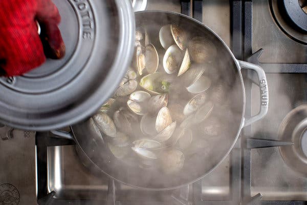 The clams are steamed in a combination of broth and wine, and are done in no time at all.
