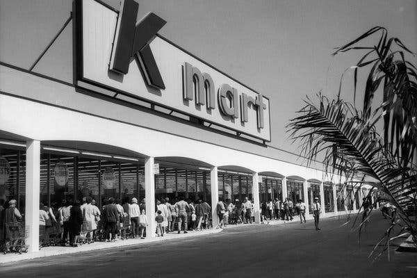 Shoppers wait to enter a Kmart store in 1962.