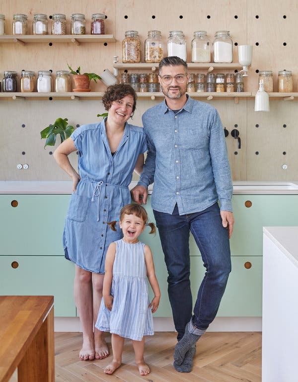 Bobby Johnston and Ruth Mandl (shown with their daughter, Lucia) transformed a single-family townhouse in Bedford-Stuyvesant, Brooklyn, into a two-family passive house that generates more energy than it consumes.