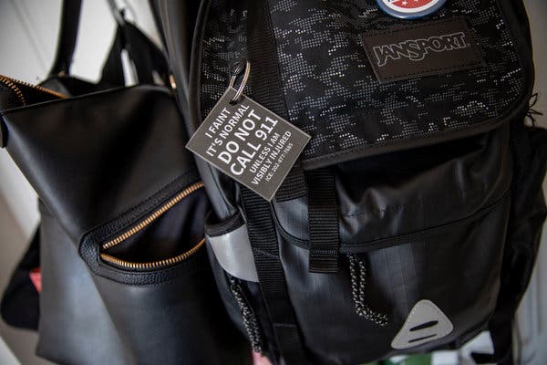 A tag on Ms. McCormick’s backpack. Koda, her medical alert dog, can smell when Ms. McCormick’s blood pressure drops, usually signaling an imminent fainting spell.