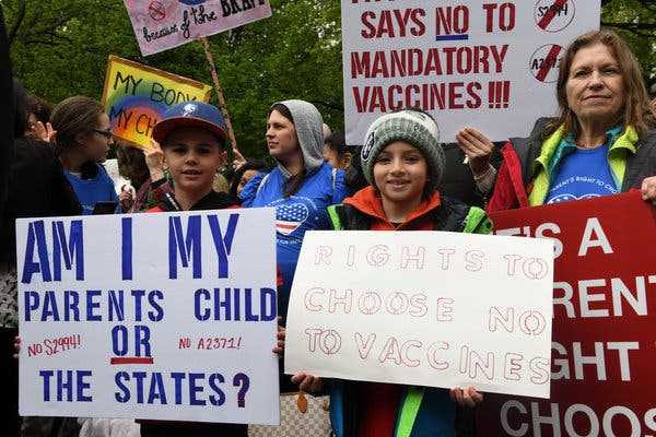 Demonstrators protesting the new state law that ends religious exemptions for vaccinations.