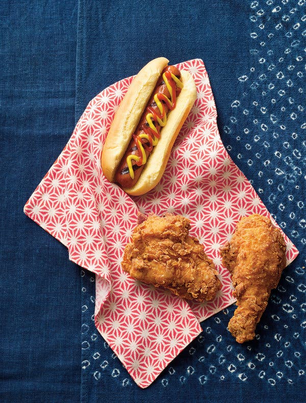 An American hot dog and fried chicken on Japanese shibori textiles.