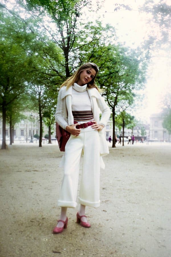 From 1971, a Sonia Rykiel white knit ensemble with a red purse and belt from the brand.