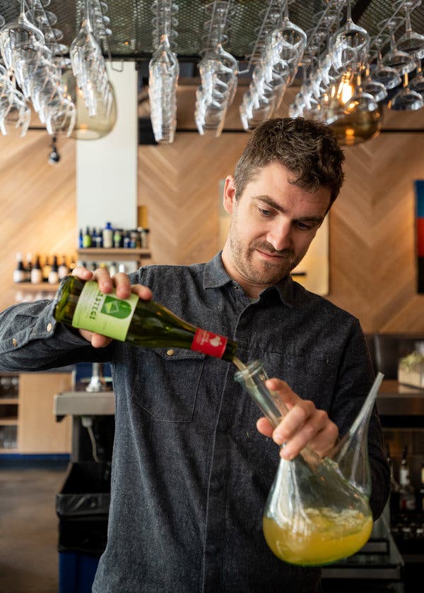 Michael Elmore, a partner and general manager of Arcana, a restaurant in Boulder, Colo., uses porróns to serve cider.