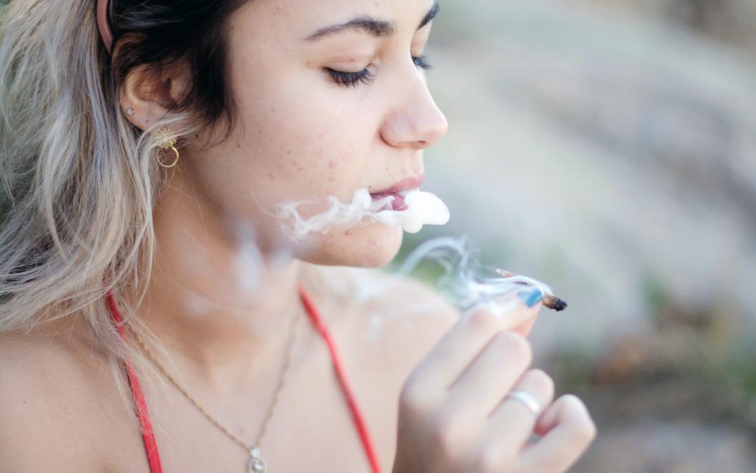 a woman smoking marijuana and feeling what its like to be high. 