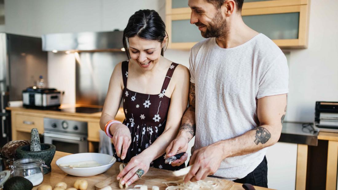 a couple cooking food together for the best diet for mental health