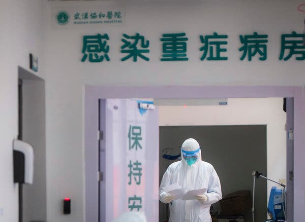 A health worker in the Department of Infectious Diseases at Wuhan Union Hospital on Tuesday. Wuhan, China, is the epicenter of a growing outbreak that has killed more than 100 people so far.