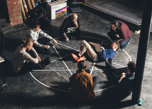 A pentagram serves as both d&eacute;cor and an ad-hoc meeting space.