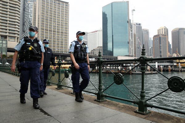 Police officers patrolling in Sydney, Australia, on Saturday, before roughly 250 people in the city protested against the latest lockdowns.
