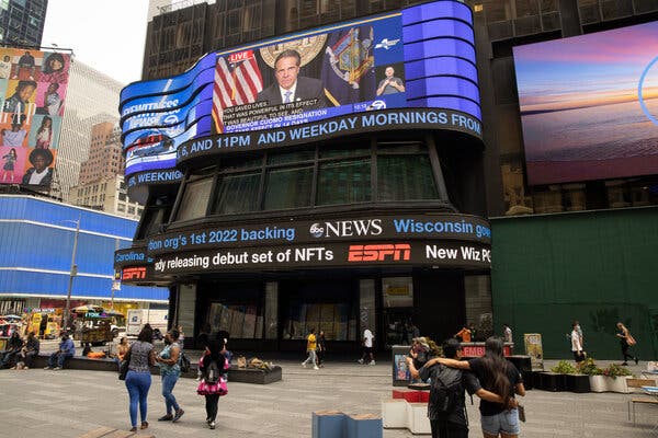 A news broadcast in Times Square on Tuesday as Gov. Andrew M. Cuomo of New York announced that he would resign, capping a remarkable political fall.